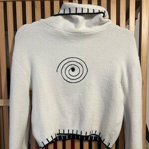 White Turtleneck Sweater with Spiral Design